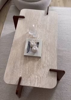 a coffee table with two cups on it