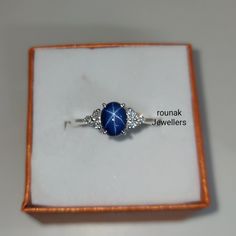 BAND- ROUNAK JEWELLERS MATERIAL- 925 STERLING SILVER GEMSTONE - LAB BLUE STAR SAPPHIRE BLUE STAR STONE WEIGHT - 2.15 CARAT BLUE STARSTONE SIZE -7.90X 6 MM SECONDARY STONE - CUBIC ZIRCONIA ZIRCONIA STONE WEIGHT - 0.14 CARAT ZIRCONIA STONE SIZE - 1.70 MM GROSS WEIGHT - 3.160 GM STONE SHAPE - OVAL, ROUND GEM COLOUR - BLUE, WHITE PLEASE GIVE YOUR OPENION OR FEEDBACK ABOUT THE PRODUCT. WE ACCEPT BULK ORDER ALSO. https://www.etsy.com/in-en/shop/RounakJewellers?ref=search_shop_redirect Star-shaped Sapphire Ring As Gift, Star-shaped Sapphire Ring For Gift, Star Shaped Sapphire Jewelry For Anniversary, Sterling Silver Sapphire Star Jewelry, Silver Celestial Jewelry With Center Stone, Celestial Silver Jewelry With Center Stone, Blue Star Sapphire Ring, Star Sapphire Ring, Blue Star Sapphire