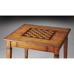 a wooden table with a chess board on it's top and drawers underneath the table