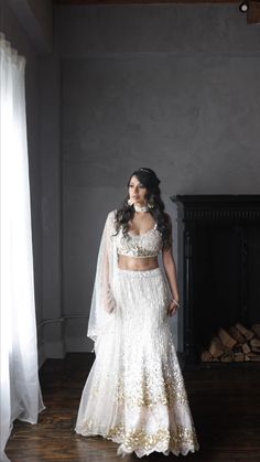 Diamonds got nothing on you.
Verona is a stunning ivory lehenga with touches of gold and pink, adorned with sequins, stones, pearls, and tassels all over. The blouse is delicately crafted with three-dimensional flowers and pearl straps.
MUA: @dgmakeup_
Hair: @stylesbynimra
Photographer: @fidaiphotography
Jewelry: @inaury.official
Model: @love_joy29
.
#PanacheBySharmeen #weddinglehenga #southasianweddings
desi wedding guest outfit, desi wedding attire, indian wedding guest attire, party wear indian dresses, designer formal dresses, modern indian dresses, traditional indian bridal Wedding Choli With Pearl Embroidery And Traditional Drape, Bollywood Pearl Embroidered Dupatta For Reception, White Bollywood Sharara With Pearl Embroidery, Bollywood Style Sharara With Pearl Embroidery For Reception, Traditional White Hand Embellished Dupatta, Traditional White Hand-embellished Dupatta, White Wedding Gown With Mirror Work, Glamorous Embellished Wedding Dupatta, Traditional White Embellished Lehenga