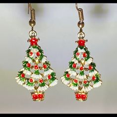 Green Christmas Trees Adorned With Red Ornaments And Sprinkled With White Snow And Gold Trim. Tree Measures 1 1/2” Plus The Hanging Hook For Pierced Ears. Great Holiday Look. Red Jewelry For Christmas Celebration, New Year Holiday Jewelry, Red Jewelry For Christmas Holiday, White Holiday Party Jewelry, White Jewelry For Holiday Party, Red Holiday Jewelry For Festive Occasion, White Holiday Jewelry For Festive Occasions, White Christmas Festive Jewelry, White Christmas Jewelry For Festive Season