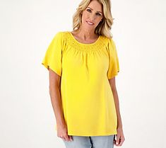 Boost your basic tee collection with this smocked boat neckline top that elevates everything from daily denims to summery capris. From Denim & Co.® Fashions. Stretch Tops For Casual Summer, Stretch Tops For Casual Summer Gatherings, Summer Casual Stretch Tops, Summer Tops With Smocked Bodice In Solid Color, Spring Tops With Smocked Back And Relaxed Fit, Summer Top With Elastic Neckline And Short Sleeves, Casual Tops With Smocked Cuffs And Relaxed Fit, Summer Tops With Smocked Bodice, Relaxed Fit Smocked Top For Summer Day Out