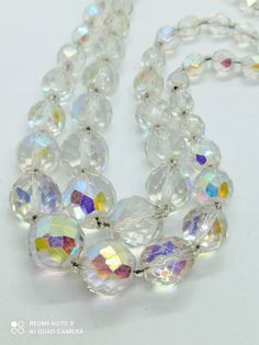 2 strand Czech crystal bead necklace, glittering Aurora borealis rhinestone necklace, noble rhinestone clasp, wedding necklace vintage 60s materials: glass, Czech Aurora Borealis crystal Length: 50 cm the longest Necklace in 2 strands, rows Very beautiful old case clasp adorned with three large AB rhinestones 8mm bead size Gorgeous Vintage Czech Crystal Bead Necklace Multilayer Aurora Borealis Rhinestone Necklace- Condition- in good vintage condition Evening, engagement, wedding necklace Clear Faceted Beads Jewelry For Party, Clear Jewelry With Faceted Beads For Party, Party Beaded Clear Jewelry, Clear Beaded Party Jewelry, Clear Beaded Jewelry For Party, Formal Crystal Jewelry With Faceted Beads, Formal Crystal Beaded Necklaces With Round Beads, Single Strand Crystal Necklaces With Round Beads, Crystal Single Strand Necklace With Round Beads