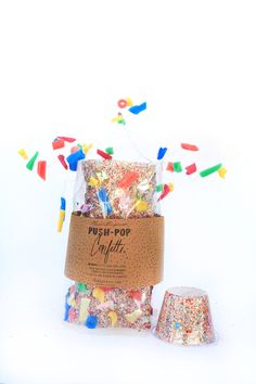 a bag filled with confetti and sprinkles on top of a table