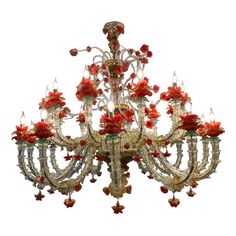 a fancy chandelier with red flowers on it