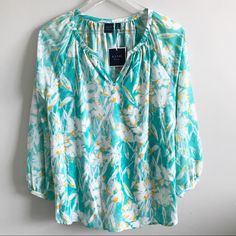 Turquoise Floral Top Fabric: 100% Polyester Care: Machine Washable Casual Turquoise V-neck Blouse, Turquoise Floral Print Top For Spring, Casual Turquoise Top For Spring, Casual Turquoise Beach Blouse, Turquoise Floral Print Tops For Beach, Turquoise Long Sleeve Tops For Vacation, Long Sleeve Turquoise Tops For Vacation, Floral Print Tunic, Black Blouse Long Sleeve