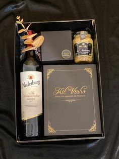 a bottle of wine and some other items in a box