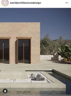 an image of a modern house in the middle of desert with two doors on each side