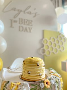 a yellow cake sitting on top of a table