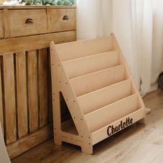 a wooden shelf sitting next to a dresser