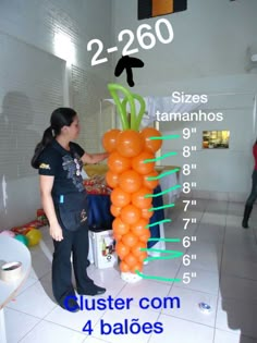 a woman standing next to a giant carrot on top of a white tiled floor in front of a wall