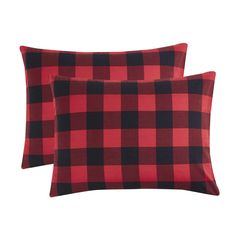 two red and black plaid pillows on a white background with the same color as the pillow