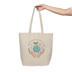 This tote bag will be the best companion on weekly shopping trips and is eco-friendly at the same time. It's made from natural, 10 oz./yd² cotton canvas fabric that is extremely durable and spacious with two comfortable shoulder straps. Material: 10oz./yd² natural cotton canvas fabricOne size: 18" x 15" (45.7cm x 38.1cm)Easy-carry handles and a spacious bottom 18" x 15" Width, in 17.99 Height, in 15.00 Total handle length, in 30.00 Refund / Exchange Policy: Since products are only printed once o Our Earth, Cotton Canvas Fabric, Photo Proof, Candle Cup, Be The Best, Shopping Tote, Shopping Trip, Our Home, Natural Cotton