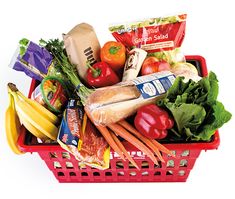 a red shopping basket filled with lots of food