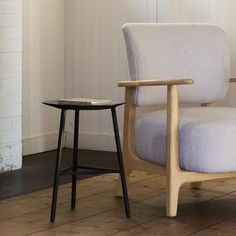 a chair and side table in a room