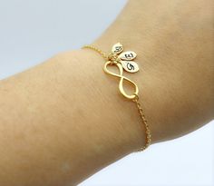 Infinity symbol represents continuous connection, eternity and everlasting love. Personalize this gold infinity bracelet by adding the initials of loved one.   Silver infinity bracelet: https://www.etsy.com/ca/listing/197354727/sterling-silver-infinity-bracelet-dainty?click_key=95139ec8199a44b7fdc5032d6bdb60da6c91e12d%3A197354727&click_sum=66eaad64&ref=shop_home_active_2 Rose gold infinity bracelet: https://www.etsy.com/ca/listing/1399543708/rose-gold-infinity-bracelet-with-custom?click_key=5616 Adjustable Gold Name Bracelet For Best Friend, Elegant Adjustable Name Bracelet For Best Friend, Elegant Personalized Charm Bracelet For Best Friend, Gold Initials Jewelry For Friendship, Elegant Gold Bracelets For Best Friend Gift, Dainty Infinity Jewelry For Friendship, Elegant Gold Bracelet For Best Friend, Dainty Infinity Friendship Jewelry, Personalized Infinity Bracelets For Friendship