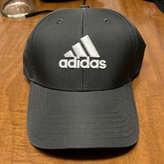 Never Worn Sporty Black Hat For Baseball Season, Classic Black Baseball Cap For Sports, Black Baseball Cap For Baseball Season, Black Adjustable Hats For Golf, Adjustable Black Golf Hat, Adjustable Black Hat For Golf, Black Curved Brim Baseball Cap For Golf, Adidas Black Hat With Curved Brim, Black Snapback Golf Hat