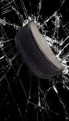 an ice hockey goalie's net is shattered in black and white