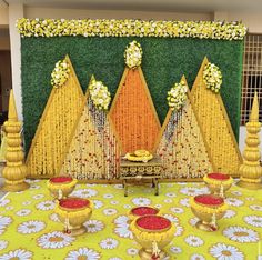 a decorated stage set up with yellow and red decorations