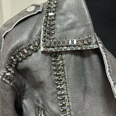 Grey Faux Leather Cropped Jacket Embellished With Large Crystals! Nwt Size S/M Edgy Leather Jacket With Rhinestone Rivets For Winter, Black Leather Jacket With Rhinestone Rivets For Winter, Biker Leather Jacket With Rhinestone Rivets, Luxury Embellished Long Sleeve Leather Jacket, Studded Long-sleeved Moto Outerwear, Cropped Moto Jacket, Cropped Jacket, Large Crystals, Moto Jacket