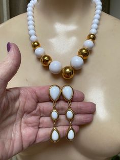 "You must have at least one set of white jewelry just for summer. White pearls don't count. I'm talking fun stuff. Necklace is signed Napier and earrings signed Trifari. Necklace will extend from 16 to 18\" with a hook clasp. Largest front beads are about 18 and 20mm round. They continue to be fairly big at about 10mm near clasp. Earrings are clip backs marked Trifari. Big look at 3\" but the largest section is against the earlobe. Not heavy anyway but I think the largest bead at top is a good i White Dangle Jewelry Sets For Formal Occasions, White Teardrop Jewelry For Formal Occasions, Modern White Jewelry With Pearl Drop, White Drop Earrings For Formal Occasion, White Drop Jewelry For Formal Occasions, Modern White Pearl Drop Jewelry, White Dangle Necklaces With Matching Earrings, Formal White Drop Jewelry, Modern White Teardrop Necklace