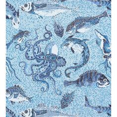 a blue and white tile with fish on it