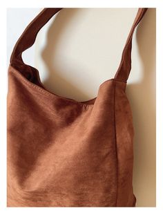 Carry your essentials in style with the Elena Handbags Soft Suede Shoulder Bag. Made of luxurious suede, this bag is both soft and durable. With its roomy interior and adjustable strap, it's perfect for everyday use. Upgrade your handbag game with Elena Handbags. Material: High Quality Suede PU Leather Size approximately 14.5"H x 13.7"W x 4.7"D Designer Style ID: 8786 Designer Style, Winter Sale, Soft Suede, Pu Leather, Adjustable Straps, Shoulder Bag, Handbags, High Quality, Fashion Design