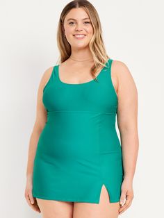 scoop neck adjustable spaghetti straps removable pads seamed empire waist built-in briefs vented front quick drying semi fitted hits high on thigh models are approx.  5'9" and wear sizes s (4), l (12), and xl (18) Sleeveless Swim Dress With Built-in Liner For Summer, Fitted Sleeveless Swimwear With Built-in Liner, Fitted Green Tank Top With Built-in Bra, Fitted Sleeveless Swim Dress With Built-in Liner, Solid Sleeveless Swim Dress With Built-in Bra, Fitted Swimwear With Built-in Bra And Tank Straps, Fitted Tankini With Built-in Bra And Scoop Neck, Beach Tankini With Medium Bust Support, Sleeveless Beach Tankini With Medium Bust Support