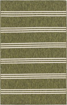 a green rug with white stripes on it