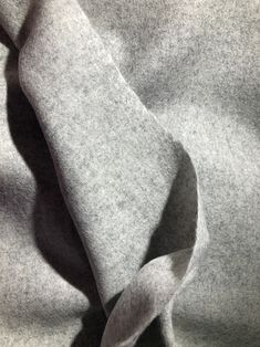 a close up view of a gray fabric