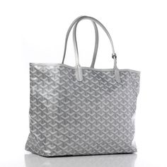 This is an authentic GOYARD Goyardine Saint Louis PM in Silver. This stylish tote is a limited edition and part of the "Precious Metals Collection". It is crafted of the classic Goyard chevron monogram on grey metallic coated canvas. This handbag features sturdy silver leather shoulder straps and top trim. The top opens to a spacious natural fabric interior with a matching removable pouch. Natural Fabric, Christmas 2024, Saint Louis, How To Make Notes, Natural Fabrics, St Louis, Precious Metals, Shoulder Straps, Luxury Bags