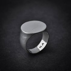 A handmade sterling silver 925 blank round signet stamp ring.Each ring is cleaned and polished with care.The weight of the ring may vary according to size.Top measurements: Width - 17mm | Height - 17mmApprox weight:  9.12grThe ring is made of sterling silver 925 and is water resistant.This awesome signet ring is available in more shapes! Click here to see:Rectangle: https://www.etsy.com/il-en/listing/543815352/rectangle-sterling-silver-signet-ringOctagon: https://www.etsy.com/il-en/listing/54381 Signet Ring Silver, Stamp Ring, Personalized Initial Ring, Stamped Rings, Silver Signet Ring, Top Measurements, Initial Ring, Pet Necklace, Skull Ring