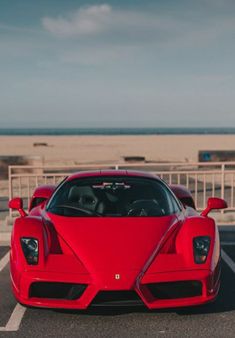 a red sports car parked in a parking lot