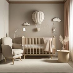 a baby's room with a crib, rocking chair and hot air balloon