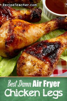 the best damn air fryer chicken legs recipe is on a plate with lettuce and ketchup