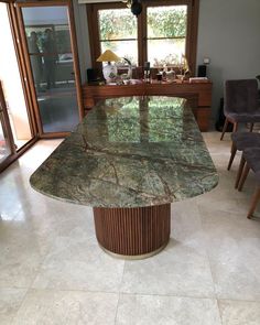 a large marble table in the middle of a room