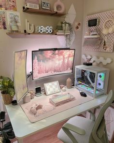 a computer desk topped with a monitor and keyboard