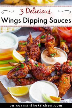 three delicious wings dipping sauces with lemon wedges and celery on the side