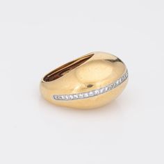 Rare vintage Tiffany & Co diamond dome ring designed by Paloma Picasso, crafted in 18 karat yellow gold & platinum (circa 1980).    33 round brilliant & single cut diamonds total an estimated 0.33 carats (estimated at G-H colour and VS2-SI1 clarity).  Dating to 1980 the 18k gold dome ring, with a central strand of diamonds, is designed by Paloma Picasso for Tiffany & Co, the same year she started her design work at Tiffany (and continues today). Paloma Picasso has a love of big gemstones and bol Yellow Gold Oval Dome Ring With Pave Setting, Classic Yellow Gold Domed Diamond Ring, Fine Jewelry Oval Dome Ring With Single Cut Diamonds, Timeless Gold Dome Ring With Diamond, Oval Dome Ring With Single Cut Diamonds Fine Jewelry, Gold Diamond Dome Ring With Brilliant Cut, Oval Yellow Gold Diamond Dome Ring, Timeless Gold Domed Diamond Ring, Timeless Domed Gold Diamond Ring