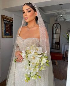 a woman in a wedding dress holding a bouquet