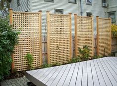 a wooden deck in front of a house