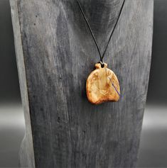 "Prices given are total prices. VAT is not shown due to small business status according to § 19 UStG." A fancy pendant which was made of beautiful real wood. On the front of the pendant, a naturally occurring indentation in the wood was filled with blue pigments, which provide a special contrast and a great play of colors. A delicate line filled with blue pigments can also be seen on the back. The wood is natural and not colored, has been elaborately processed, sanded and polished by hand. For a Wooden Creations, Fancy Pendant, Business Status, Blue Pigment, Adjustable Knot, Necklace Unique, Jewelry Pendant, Wooden Jewelry, Unique Necklaces