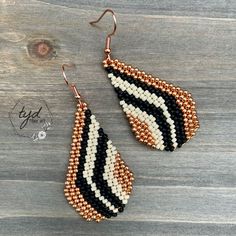 These earrings are expertly handwoven, hand beaded, and intricately designed.   Woven with small Miyuki glass seed beads and strong nylon thread to last a lifetime.   Each tiny bead is selected and hand sewn one at a time with a needle and thread.  These Farrah earrings are made with black, cream and copper colored beads.  I love the mix of different finishes on the beads, so easy to dress up or down. Farrah earrings measure 2 3/8 inches long by 1 inch wide.   Ear wires are copper.   Lightweight and comfortable, these earrings are perfect to wear everyday. Teardrop Tiny Beads For Jewelry Making, Adjustable Handwoven Teardrop Jewelry, Handmade Teardrop Beads For Jewelry Making, Artisan Handwoven Teardrop Jewelry, Artisan Teardrop Beaded Earrings With Dangling Beads, Artisan Colorful Beaded Teardrop Earrings, Adjustable Teardrop Beaded Earrings With Black Beads, Black Beads Teardrop Earrings, Black Beaded Teardrop Earrings