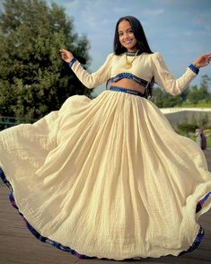 Experience the fusion of tradition and modernity with our stunning blue Habesha dress, featuring a stylish crop top and skirt set. Culture Clothes, Stylist Quotes, Dress Crop Top, Eritrean Dress, Dress Coats, Habesha Dress, Crop Top And Skirt Set, Ethiopian Dress, Habesha Kemis