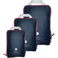 three pieces of blue and red luggage on a white background, with one bag in the middle