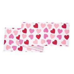 two pink and red hearts on white paper