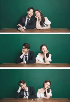 two people sitting at a table in front of a green wall and posing for the camera