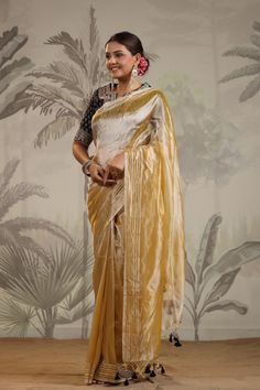 Shop yellow tissue silk sari online in USA with embroidered blouse. Make a fashion statement on festive occasions and weddings with designer suits, Indian dresses, Anarkali suits, palazzo suits, designer sarees, sharara suits, Bollywood saris from Pure Elegance Indian fashion store in USA.-full view Yellow Tissue Silk Pre-draped Saree For Navratri, Gold Tissue Silk Blouse With Dupatta, Festive Yellow Tussar Silk Pre-draped Saree, Yellow Semi-stitched Cotton Silk Saree, Yellow Cotton Silk Pre-draped Saree With Unstitched Blouse, Designer Yellow Cotton Silk Blouse Piece, Gold Cotton Silk Saree For Party, Party Gold Cotton Silk Saree, Elegant Yellow Cotton Silk Pre-draped Saree