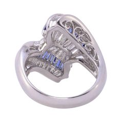 This is part of Chairish’s Fine Jewelry assortment.  Estate baguette sapphire & diamond platinum ring. This platinum ring features 57 tapered diamonds at 1.29 carat total weight having SI clarity and G-H color. There are also 32 baguette sapphires at 1.34 carat total weight. This sapphire & diamond ring is a size 6.5 and is appraised at $6800. [ADTI 58]  Metal: Platinum  Stone: Diamond,Sapphire  Stone Cut: Baguette Cut Vintage Platinum Rings, 1 Carat Diamond Ring, Platinum Diamond Rings, Diamond Wedding Sets, Sapphire Diamond Ring, Pear Diamond, Platinum Ring, Blue Zircon, Sapphire Stone