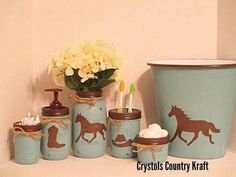 bathroom accessories with horses painted on the jars